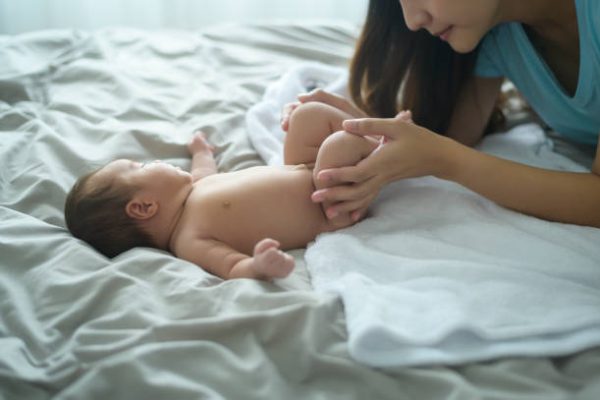 A Young mother with a Cute new born baby.